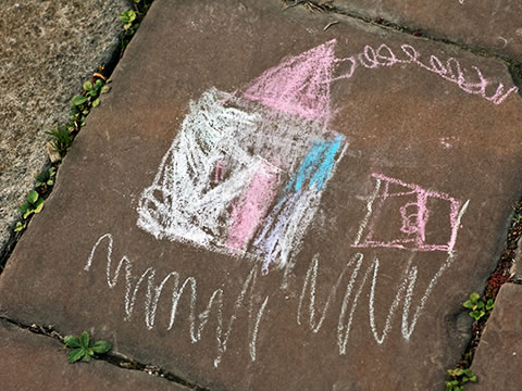 child's chalk drawing on pavement